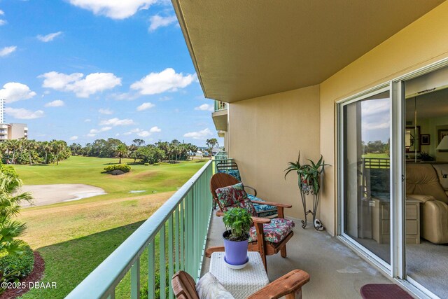 balcony featuring golf course view
