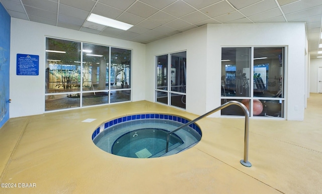 view of swimming pool with an indoor in ground hot tub