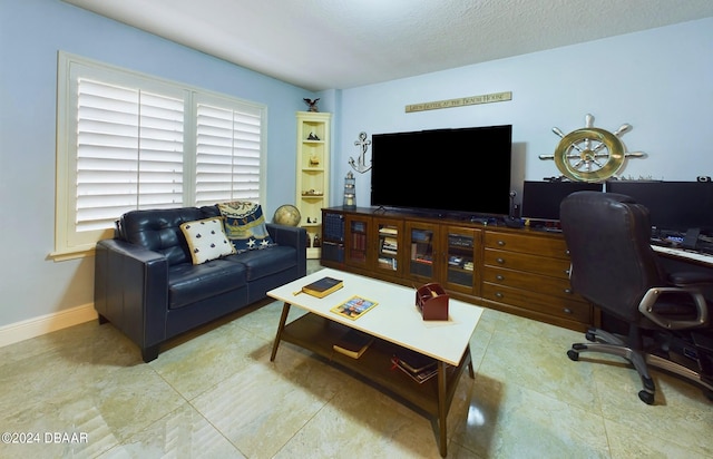 living room with a textured ceiling