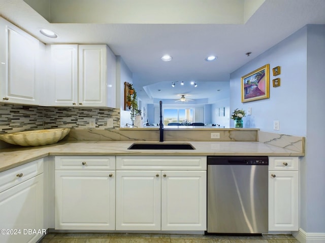 kitchen with dishwasher, white cabinetry, sink, and tasteful backsplash