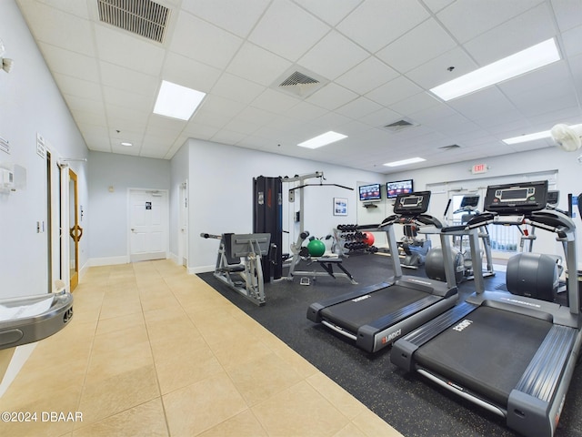 exercise room featuring a drop ceiling