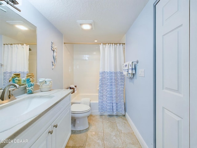 full bathroom with vanity, shower / bath combo with shower curtain, a textured ceiling, and toilet