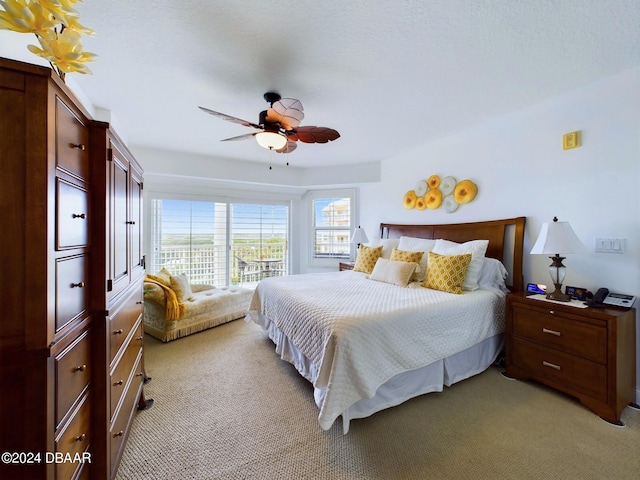 bedroom with light colored carpet and ceiling fan