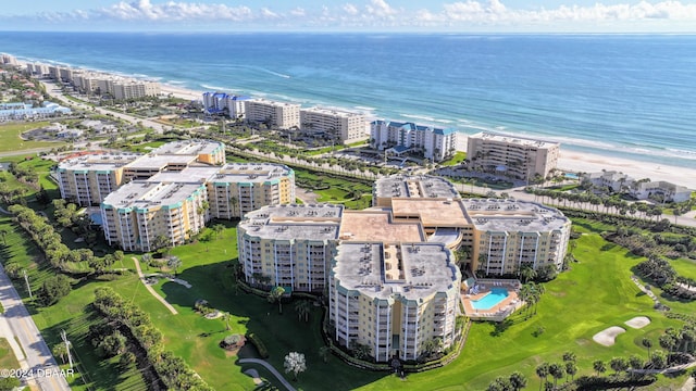 drone / aerial view with a water view and a beach view