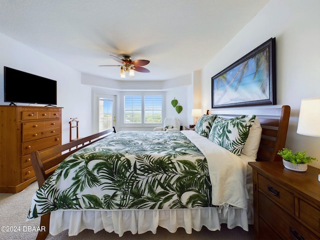 bedroom with light carpet and ceiling fan