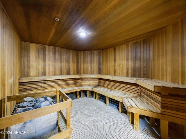 view of sauna with wooden walls and wooden ceiling