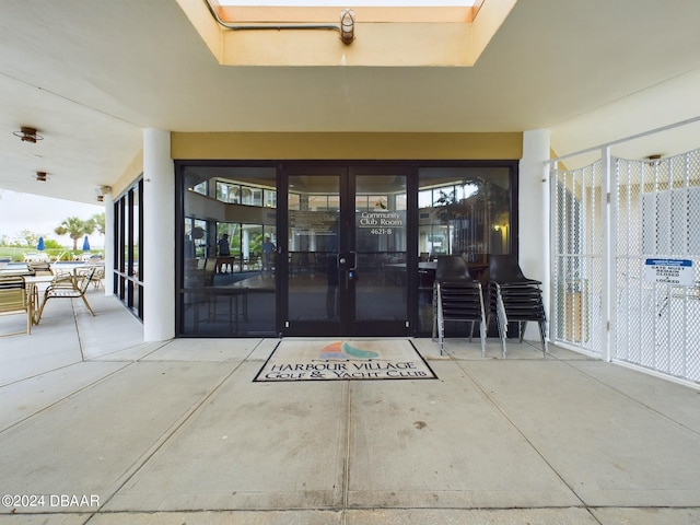 entrance to property featuring a patio and french doors