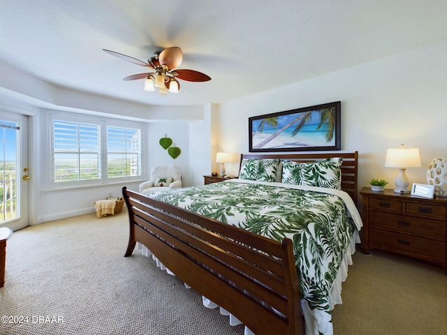 carpeted bedroom with access to outside and ceiling fan