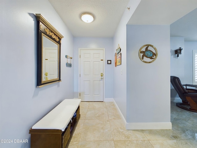 interior space with a textured ceiling