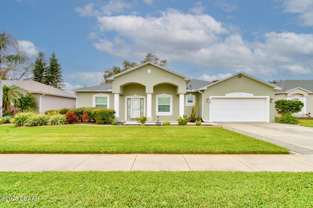 view of front of house with a garage and a front lawn