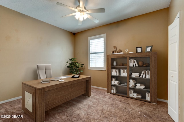 office space featuring light colored carpet and ceiling fan