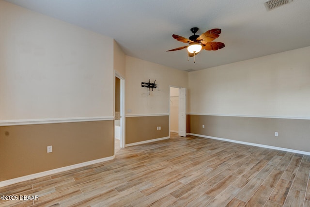 unfurnished room with ceiling fan and light wood-type flooring