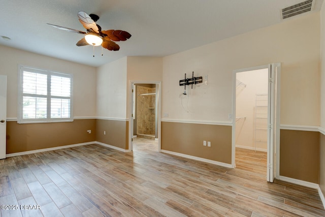 spare room with ceiling fan and light hardwood / wood-style flooring