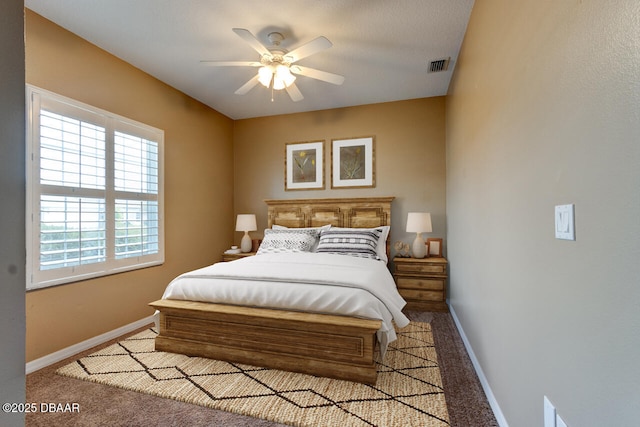 bedroom with ceiling fan and light carpet