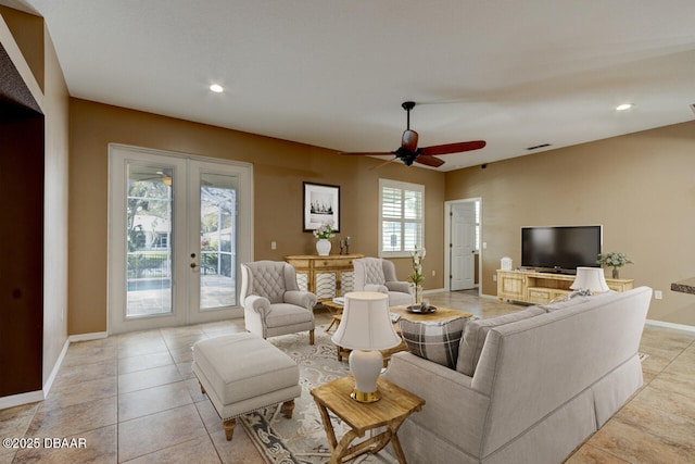 living room featuring french doors, ceiling fan, and light tile patterned floors