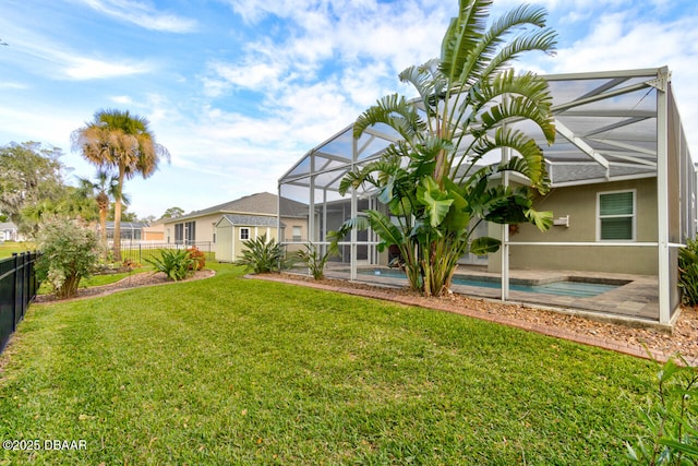 view of yard featuring glass enclosure