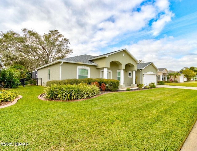 view of front facade with a garage and a front yard