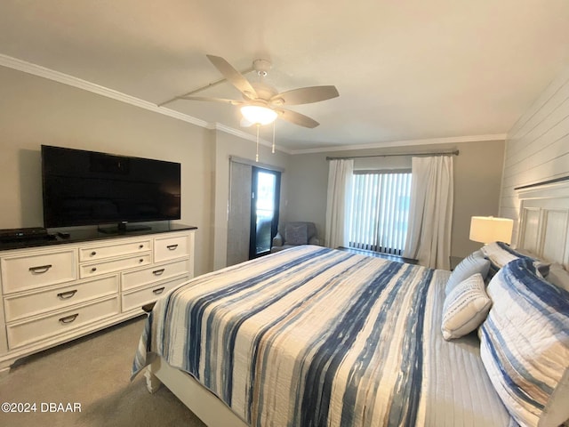 carpeted bedroom featuring ceiling fan and crown molding