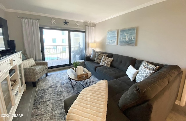 living room with hardwood / wood-style flooring and crown molding