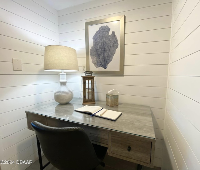 office space with wood walls