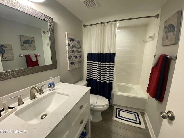 full bathroom featuring vanity, shower / bath combination with curtain, and toilet