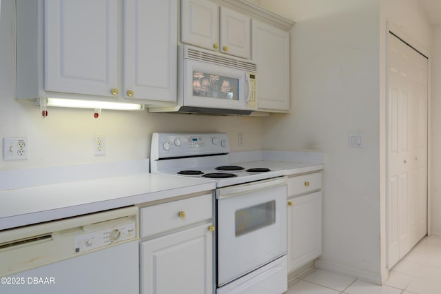 149 Gala Cir, Daytona Beach, FL 32124 - kitchen featuring white appliances, light countertops, light tile patterned flooring, and white cabinetry