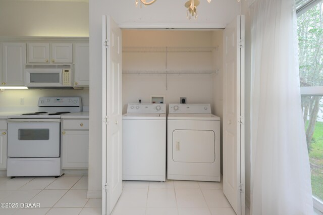 149 Gala Cir, Daytona Beach, FL 32124 - washroom featuring independent washer and dryer and light tile patterned floors