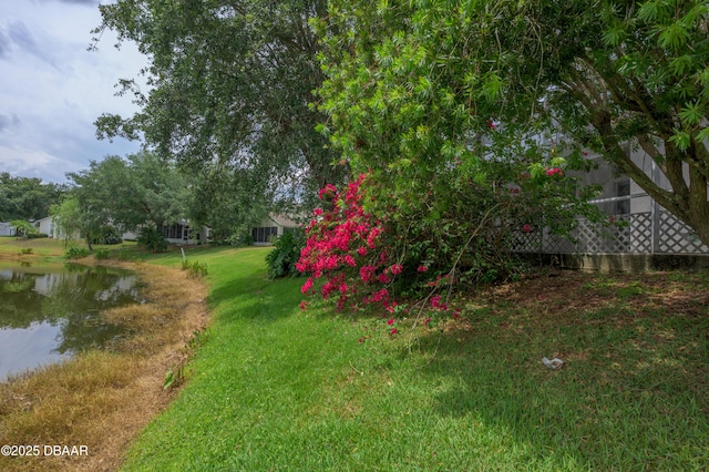 149 Gala Cir, Daytona Beach, FL 32124 - view of green lawn with a water view