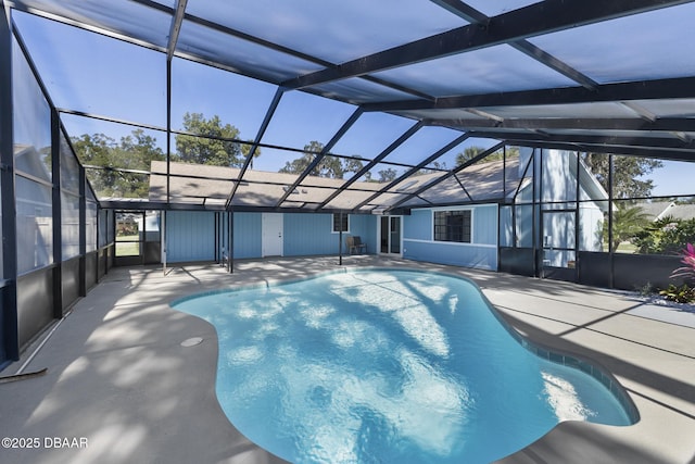 view of swimming pool with a lanai and a patio