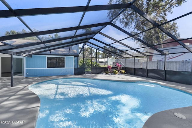 view of swimming pool with a lanai and a patio area