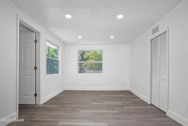 1324 Powers Ave, Holly Hill, FL 32117 - unfurnished bedroom featuring wood finished floors, recessed lighting, and a closet
