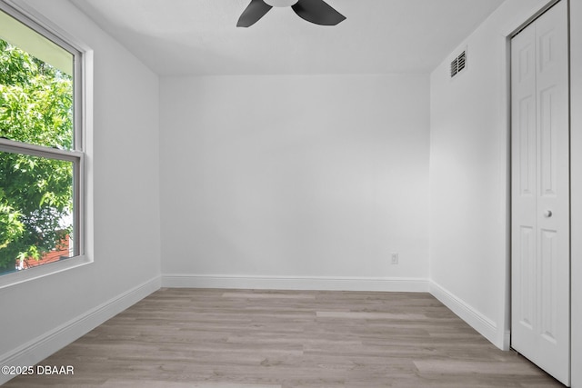 1324 Powers Ave, Holly Hill, FL 32117 - unfurnished bedroom featuring a closet, light wood finished floors, and ceiling fan