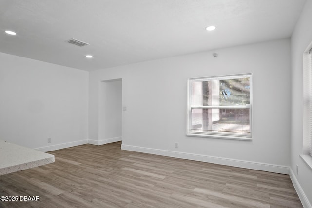 1324 Powers Ave, Holly Hill, FL 32117 - spare room with wood finished floors and recessed lighting