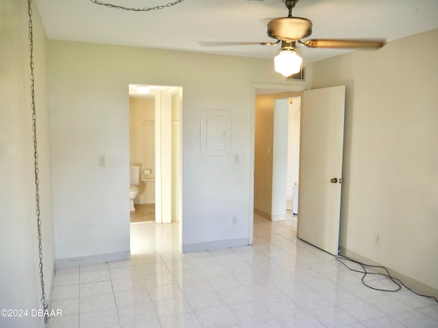 unfurnished bedroom featuring electric panel, ceiling fan, and light tile patterned floors