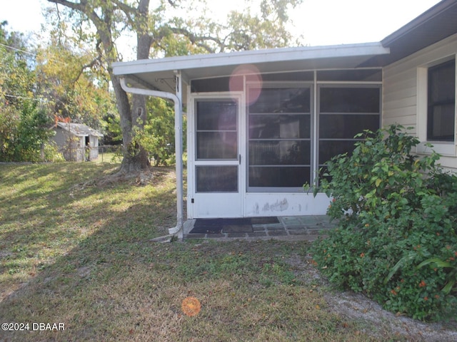 view of property exterior featuring a lawn