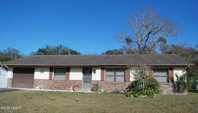 single story home with a front yard and a garage