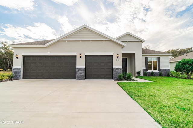 view of front facade with a garage and a front yard