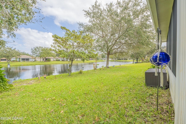 316 Dahoon Holly Dr, Daytona Beach, FL 32117 - view of green lawn with a water view and cooling unit