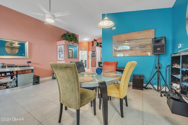 316 Dahoon Holly Dr, Daytona Beach, FL 32117 - dining space with vaulted ceiling, ceiling fan, baseboards, and tile patterned flooring