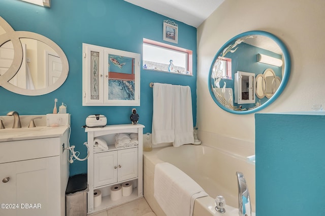 316 Dahoon Holly Dr, Daytona Beach, FL 32117 - bathroom featuring vanity, a bath, and tile patterned floors
