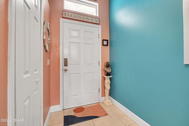 316 Dahoon Holly Dr, Daytona Beach, FL 32117 - entrance foyer with light tile patterned flooring and baseboards