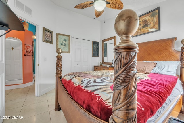 316 Dahoon Holly Dr, Daytona Beach, FL 32117 - bedroom with light tile patterned floors, a closet, ceiling fan, arched walkways, and baseboards