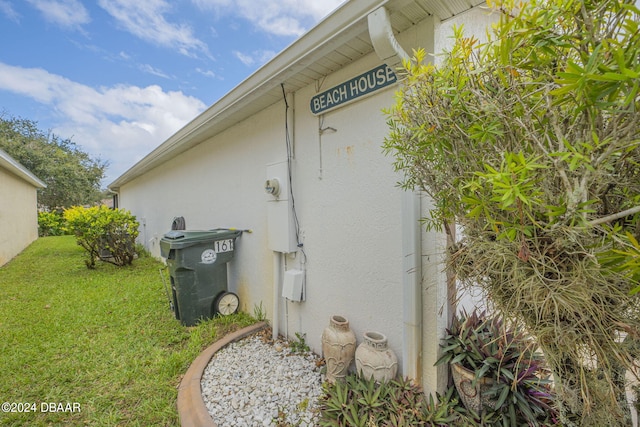316 Dahoon Holly Dr, Daytona Beach, FL 32117 - view of side of property featuring a lawn and stucco siding