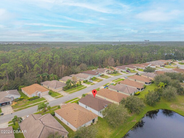 316 Dahoon Holly Dr, Daytona Beach, FL 32117 - view of property location with nearby suburban area, a forest, and a nearby body of water