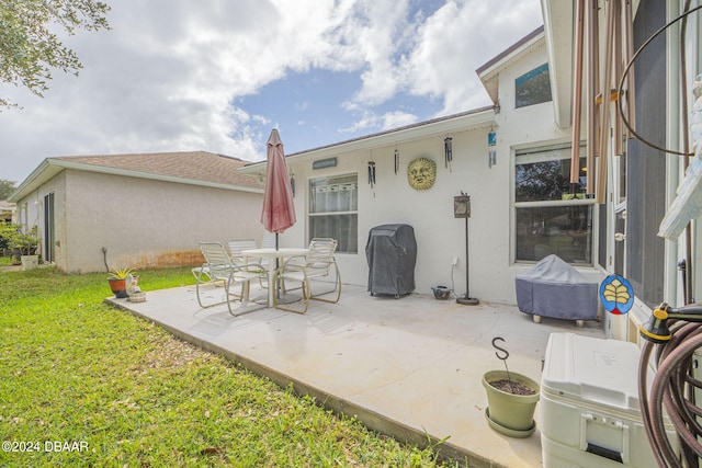 316 Dahoon Holly Dr, Daytona Beach, FL 32117 - view of patio featuring a grill