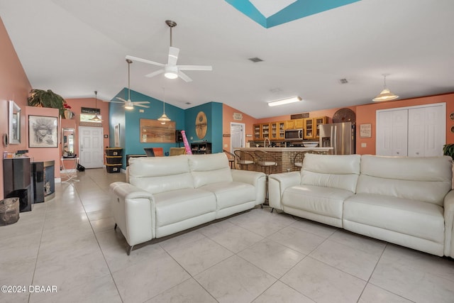 316 Dahoon Holly Dr, Daytona Beach, FL 32117 - living room with lofted ceiling, a ceiling fan, and a skylight