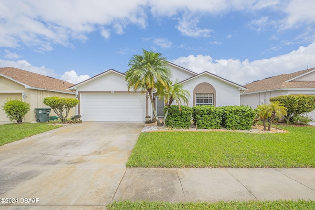 316 Dahoon Holly Dr, Daytona Beach, FL 32117 - ranch-style house with a garage, concrete driveway, stucco siding, and a front yard