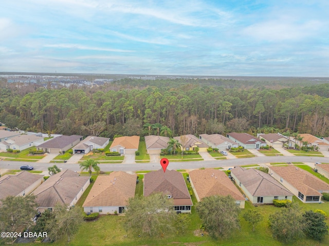 316 Dahoon Holly Dr, Daytona Beach, FL 32117 - aerial view of property and surrounding area with nearby suburban area and a heavily wooded area
