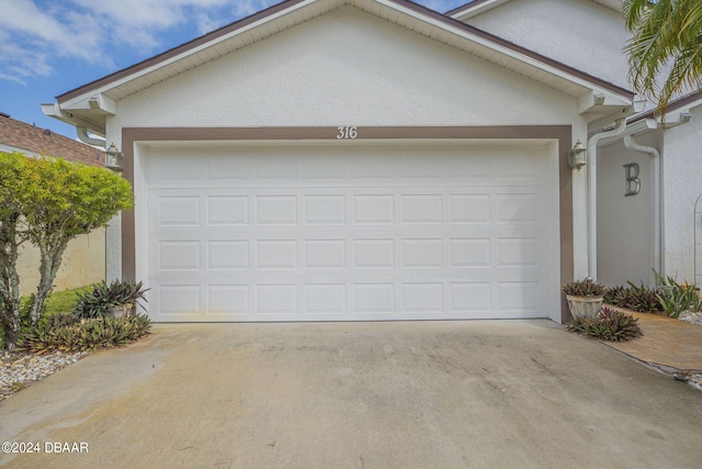 316 Dahoon Holly Dr, Daytona Beach, FL 32117 - garage with concrete driveway