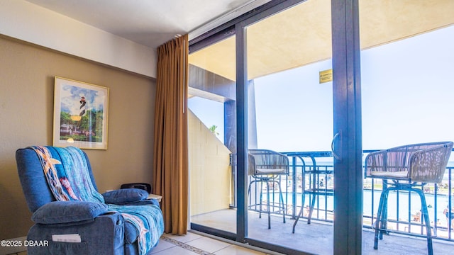 doorway to outside with tile patterned flooring and a healthy amount of sunlight